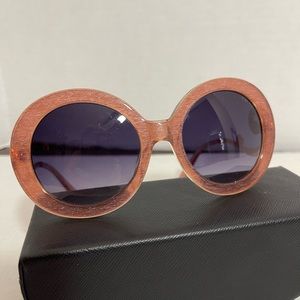 Pink sunglasses with blue tinted lenses